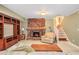 Spacious living room features a stone fireplace, built-in shelving, and tile flooring at 2447 Caladium Ne Dr, Atlanta, GA 30345