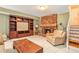 Inviting living room features a stone fireplace, built-in shelving, and tile flooring at 2447 Caladium Drive Northeast Ne, Atlanta, GA 30345