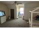 Bedroom with television on dresser, and bed with white frame, window to the outside at 7977 Woods Ln, Jonesboro, GA 30236
