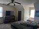 Cozy bedroom featuring neutral walls, a large dresser, and a ceiling fan for added comfort at 7977 Woods Ln, Jonesboro, GA 30236