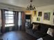Comfortable living room featuring a plush sofa, stylish artwork, and natural light streaming through the windows at 7977 Woods Ln, Jonesboro, GA 30236