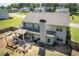 Aerial view of the property showcases a large backyard, covered patio, and proximity to neighborhood amenities at 2106 Sycamore Ln, Loganville, GA 30052