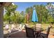 Spacious backyard features a fire pit with seating and a patio table for outdoor entertaining and relaxation at 2106 Sycamore Ln, Loganville, GA 30052
