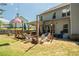 This large backyard features a spacious patio with outdoor seating and an expansive lawn perfect for recreation at 2106 Sycamore Ln, Loganville, GA 30052
