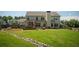 The backyard features a stone drainage feature and a large patio with seating, perfect for relaxation and entertainment at 2106 Sycamore Ln, Loganville, GA 30052