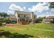 This home has a spacious lawn, large covered patio, and a fire pit area perfect for outdoor activities at 2106 Sycamore Ln, Loganville, GA 30052