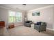 Bonus room features cozy seating area, ladder and view from the window at 2106 Sycamore Ln, Loganville, GA 30052