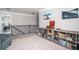 Bonus room with cozy seating area, decorative shelving and view from the staircase at 2106 Sycamore Ln, Loganville, GA 30052