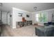 Bonus room with cozy seating area, decorative shelving and view from the window at 2106 Sycamore Ln, Loganville, GA 30052
