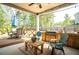 The home's spacious patio includes an outdoor kitchen, dining table, and lounge furniture ideal for entertaining at 2106 Sycamore Ln, Loganville, GA 30052