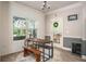 Bright dining area with shiplap walls, wood table, and view to backyard at 2106 Sycamore Ln, Loganville, GA 30052