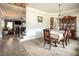 Formal dining room with hardwood floors, elegant decor, and staircase in view, perfect for Gathering gatherings at 2106 Sycamore Ln, Loganville, GA 30052