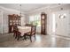 Dining room features hardwood floors, natural light, and stylish furniture for elegant dining experiences at 2106 Sycamore Ln, Loganville, GA 30052