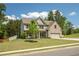 Well-maintained two-story home with brick accents, a large front yard, and a tree-lined street at 2106 Sycamore Ln, Loganville, GA 30052