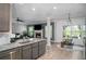 Open layout with kitchen island overlooking the living room and dining area at 2106 Sycamore Ln, Loganville, GA 30052