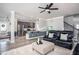 Open-concept living room showcasing an aquarium, dark leather furniture, and stairs at 2106 Sycamore Ln, Loganville, GA 30052