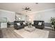 Bright living room featuring dark leather furniture, light gray walls, and decorative accents at 2106 Sycamore Ln, Loganville, GA 30052