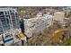 Beautiful aerial view of building complex with pool, parking garage and lush landscape at 2255 Peachtree Ne Rd # 426, Atlanta, GA 30309