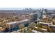 Beautiful aerial view of apartments surrounded by lush greenery and city skyline at 2255 Peachtree Ne Rd # 426, Atlanta, GA 30309