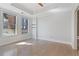 Light-filled bedroom with hardwood floors, neutral paint, crown molding and large windows at 2255 Peachtree Ne Rd # 426, Atlanta, GA 30309