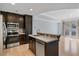 Modern kitchen featuring stainless steel appliances, dark wood cabinets, and a central island at 2255 Peachtree Ne Rd # 426, Atlanta, GA 30309