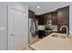 Modern kitchen with stainless steel appliances, dark wood cabinets, and light granite countertops at 2255 Peachtree Ne Rd # 426, Atlanta, GA 30309