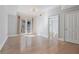 Bright living room featuring hardwood floors, neutral paint, and a balcony with double doors at 2255 Peachtree Ne Rd # 426, Atlanta, GA 30309