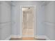 Bright walk-in closet featuring white wire shelving and a view into the primary bathroom at 2255 Peachtree Ne Rd # 426, Atlanta, GA 30309