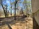 Spacious wooden back deck overlooks lush backyard shaded by mature trees at 8005 Bamby Ln, Jonesboro, GA 30236