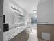 Stylish bathroom with granite countertops, vanity, tiled walls, and a window view at 8005 Bamby Ln, Jonesboro, GA 30236
