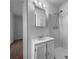 Cozy bathroom with a white sink, white cabinets, walk-in shower, and tile floor at 8005 Bamby Ln, Jonesboro, GA 30236