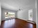 Bright living room with hardwood floors, white walls, and a large window at 8005 Bamby Ln, Jonesboro, GA 30236