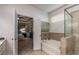 Bright bathroom with a soaking tub and tiled shower showcasing the Primary suite at 116 Holly View Ln, Canton, GA 30114