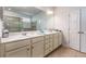 Bright bathroom featuring a double vanity with modern fixtures, large mirror, tile flooring, and a separate shower area at 116 Holly View Ln, Canton, GA 30114