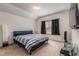 Bright bedroom with a comfortable bed, tv and natural lighting at 116 Holly View Ln, Canton, GA 30114