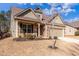 Beautiful home with manicured lawn, covered front porch, and appealing brick and siding combination at 116 Holly View Ln, Canton, GA 30114