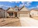 Beautiful single-Gathering home featuring a well-manicured lawn, brick accents and two car garage at 116 Holly View Ln, Canton, GA 30114