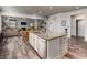 Open-concept kitchen with a large granite island, stainless appliances, and views into the living area at 116 Holly View Ln, Canton, GA 30114