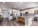 Open kitchen with a large island, stainless steel appliances, and modern finishes at 116 Holly View Ln, Canton, GA 30114