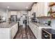 Bright kitchen featuring stainless appliances, granite countertops, and ample cabinet storage space at 116 Holly View Ln, Canton, GA 30114