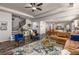 Open living space showcasing a living room, dining area, and kitchen with modern decor and comfortable seating arrangements at 116 Holly View Ln, Canton, GA 30114