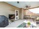 Cozy outdoor seating under a screened porch with ceiling fans and a TV, ideal for relaxing at 116 Holly View Ln, Canton, GA 30114