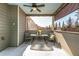 Outdoor seating area features a table and chairs, shaded by a screened enclosure with privacy shades at 116 Holly View Ln, Canton, GA 30114