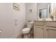 Cozy powder room featuring classic fixtures and a neutral color scheme at 116 Holly View Ln, Canton, GA 30114