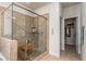 Modern shower with a glass enclosure and a convenient wooden bench in the updated main bathroom at 116 Holly View Ln, Canton, GA 30114