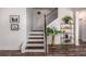 Elegant staircase with wooden handrail and stylish decor on display at 116 Holly View Ln, Canton, GA 30114