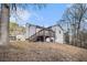 Backyard featuring a wooden deck, siding, and a beautiful, natural landscape at 2653 Del Ridge Dr, Douglasville, GA 30135