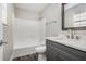 Bathroom with a shower-tub combo, modern vanity, framed mirror, and stylish wood-look floors at 2653 Del Ridge Dr, Douglasville, GA 30135