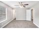 Spacious bedroom with plush carpet, ceiling fan, and ample natural light at 2653 Del Ridge Dr, Douglasville, GA 30135