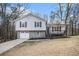 Charming split-level home with stone accents, a welcoming front porch, and a well-maintained lawn at 2653 Del Ridge Dr, Douglasville, GA 30135